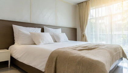 close up empty bed with pillows and blanket in the bedroom