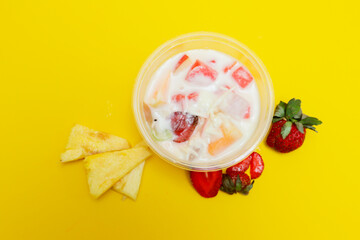 es buah or sup buah is indonesian fruit cocktail ice desert, contains strawberry, pineapple, and...