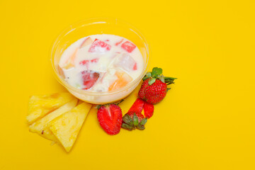 es buah or sup buah is indonesian fruit cocktail ice desert, contains strawberry, pineapple, and...