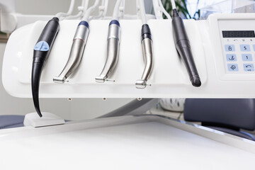 Stomatology tools. Close-up of dental drill.Different dental instruments and tools in a dentists office.