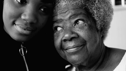 Intergenerational Bonding - African American Granddaughter and Senior Grandmother in affectionate...