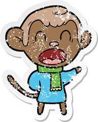 distressed sticker of a shouting cartoon monkey wearing scarf