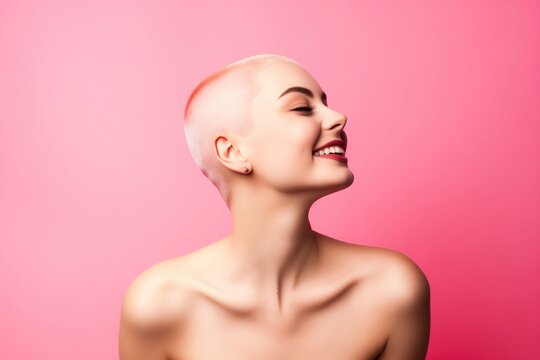 Portrait of a smiling woman with bare shoulders and bald or shaved head