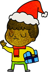textured cartoon of a grumpy boy wearing santa hat