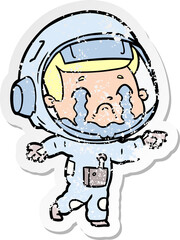 distressed sticker of a cartoon crying astronaut