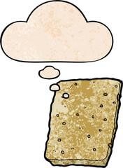 cartoon biscuit and thought bubble in grunge texture pattern style