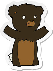 sticker of a cartoon black bear cub