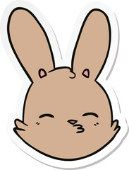 sticker of a cartoon bunny face considering