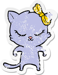 distressed sticker of a cute cartoon cat with bow