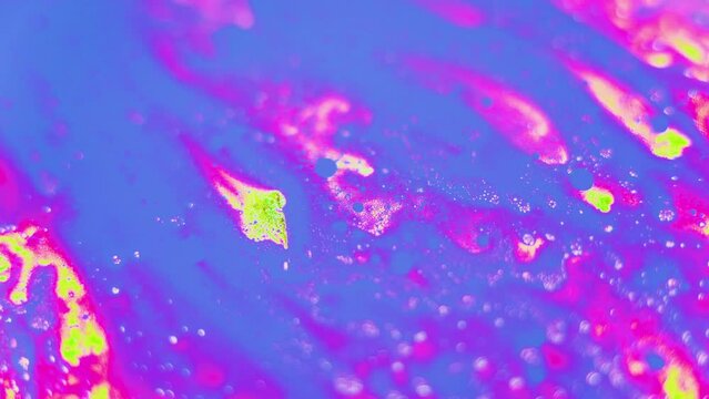 Captivating Movement of Blue and Pink Oil Paints in Water
