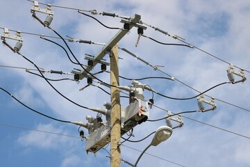 An even larger display of new technology in the electricity delivery system as no old-style round transformers are seen.