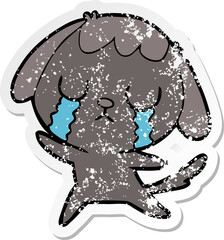 distressed sticker of a cute cartoon dog crying