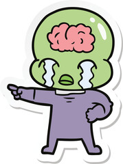 sticker of a cartoon big brain alien crying and pointing