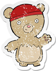 retro distressed sticker of a cartoon teddy bear wearing hat