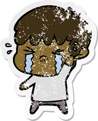 distressed sticker of a cartoon boy crying
