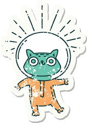 grunge sticker of tattoo style cat in astronaut suit