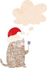 cute cartoon christmas cat and thought bubble in retro textured style
