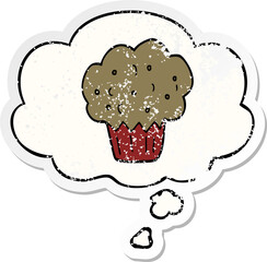 cartoon muffin and thought bubble as a distressed worn sticker