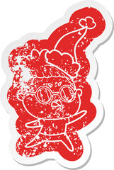 cartoon distressed sticker of a annoyed woman wearing santa hat