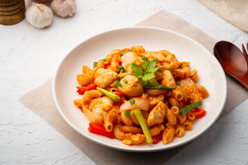 Stir Fried Macaroni with chicken breast tomatoes and egg in Tomato Sauce.fusion food
