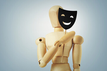 Wooden mannequin hiding half face with mask - Concept of psychology and masking personality