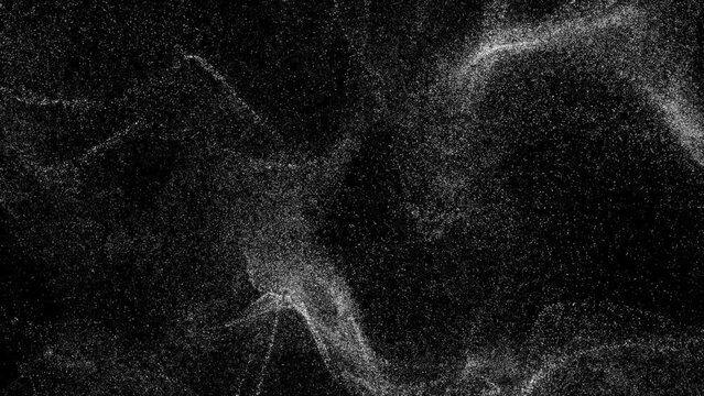 white sand particles floating on black background