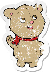 retro distressed sticker of a cartoon cute teddy bear with scarf