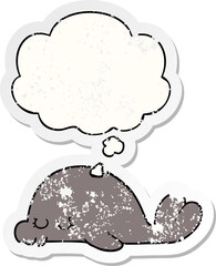 cartoon seal and thought bubble as a distressed worn sticker