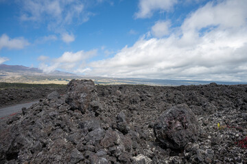 Mauna Kea on Big Island with cooled lava in the foreground 