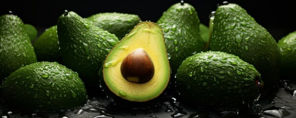 Many fresh ripe avocados with detailed water drops on dark background, food banner. Generative Ai.