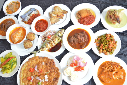 popular yummy indonesia spicy malay halal food menu curry chicken, rendang beef, asap fish, fried vegetable, begedil potato, chilli sambal achar, egg cuisine for restaurant dining