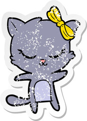 distressed sticker of a cute cartoon cat with bow