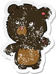 retro distressed sticker of a cartoon black teddy bear