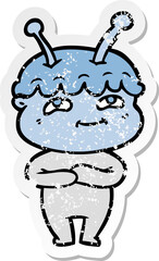 distressed sticker of a friendly cartoon spaceman