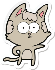 sticker of a happy cartoon cat pointing