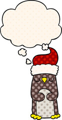cartoon christmas penguin and thought bubble in comic book style
