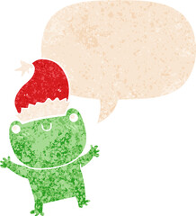 cute cartoon frog wearing christmas hat and speech bubble in retro textured style