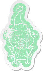 crying pig cartoon distressed sticker of a wearing santa hat
