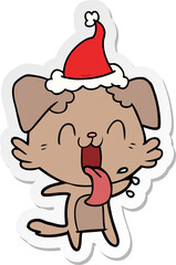 sticker cartoon of a panting dog wearing santa hat