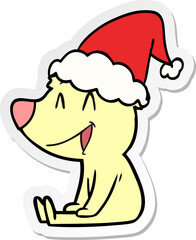 sitting bear sticker cartoon of a wearing santa hat