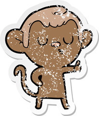 distressed sticker of a cartoon calm monkey