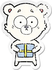 distressed sticker of a nervous polar bear cartoon with gift