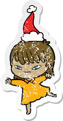 distressed sticker cartoon of a woman wearing santa hat