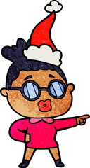 textured cartoon of a pointing woman wearing spectacles wearing santa hat
