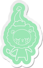 crying cartoon  sticker of a lion wearing santa hat