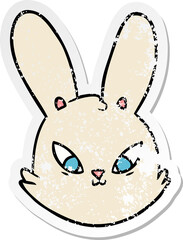 distressed sticker of a cartoon bunny face