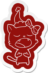 cartoon  sticker of a cat meowing wearing santa hat