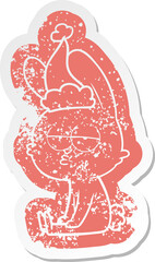 cute cartoon distressed sticker of a rabbit wearing santa hat