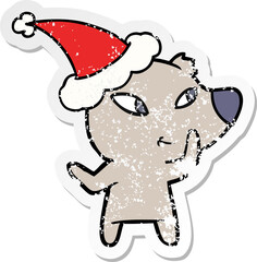 cute distressed sticker cartoon of a bear wearing santa hat