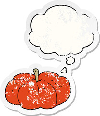 cartoon pumpkin and thought bubble as a distressed worn sticker